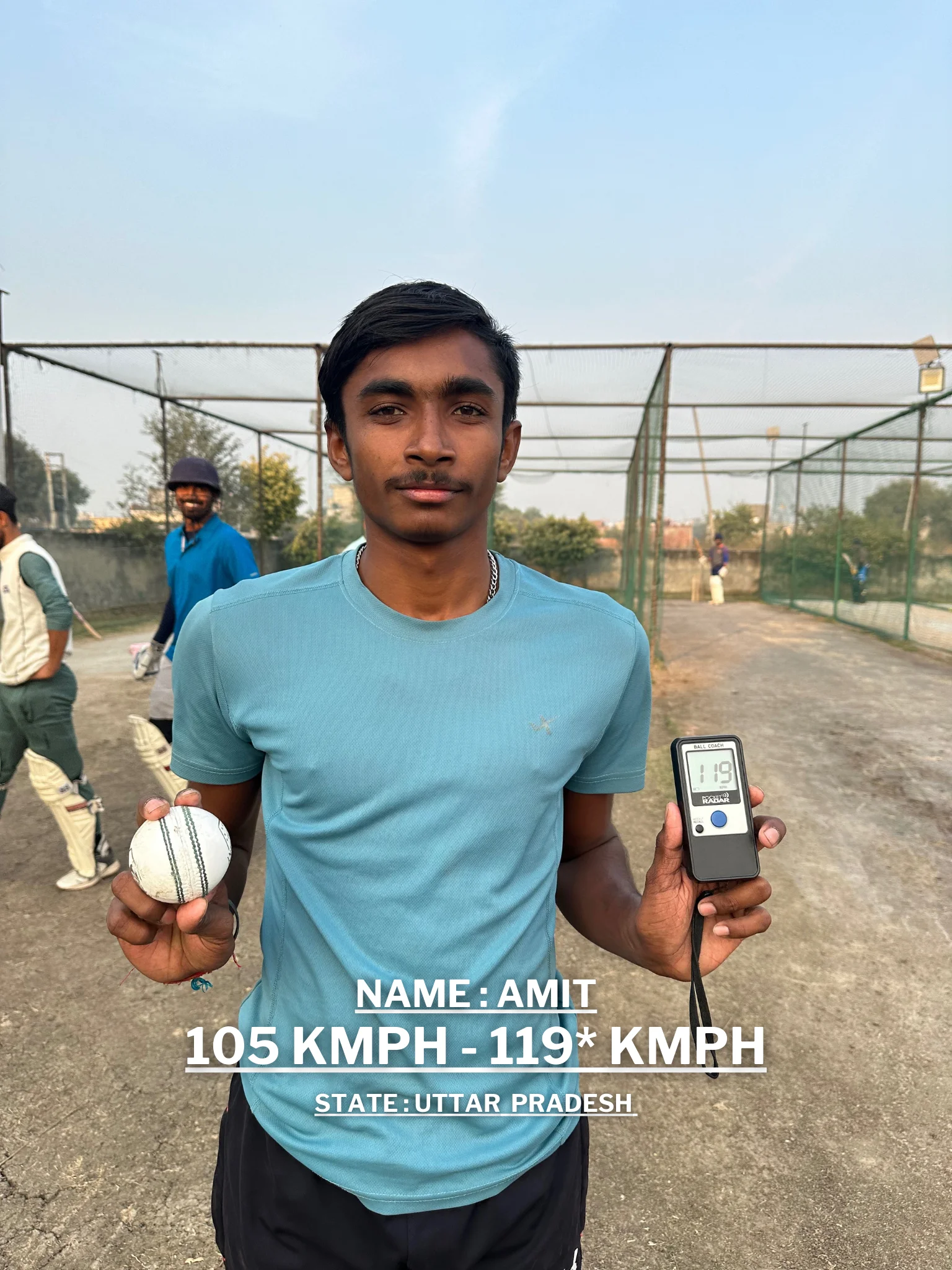 A young man is holding a cricket ball and a digital speedometer displaying his improved bowling speed at the Pathak100mph Cricket Academy.